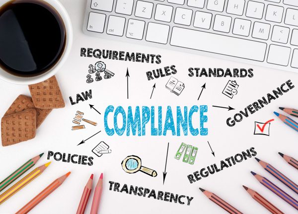 Compliance concept. White office desk Compliance